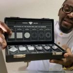 Diamond specialist showing graded diamonds